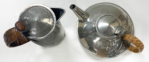 Lot 122 - Archibald Knox (1864-1933) for Liberty & Co., an Arts & Crafts Tudric polished pewter teapot