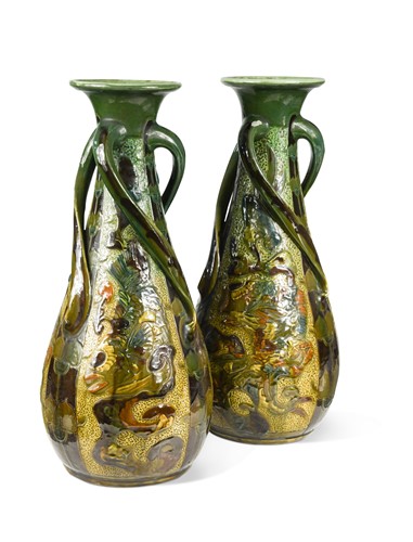 Lot 19 - James Dewdney for C.H. Brannam Barum Pottery, a large pair of art pottery vases, 1904