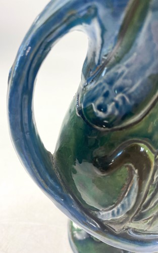 Lot 17 - C.H. Brannam for Barum Pottery, an art pottery Kingfisher jug, 1898
