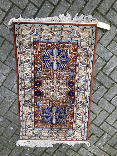 Lot 553 - A small Caucasian rug, 140 x 80cm
