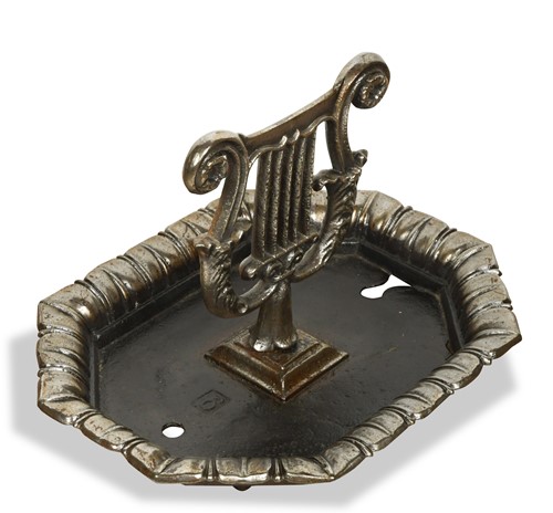 Lot 678 - A polished iron boot scraper, 19th century