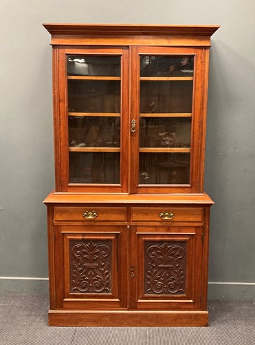 Lot 425 - A late Victorian walnut glazed top bookcase,...