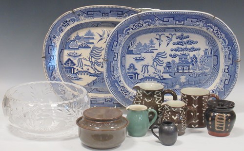 Lot 91 - Two brown slipware jugs and a similar sugar...