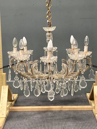 Lot 494 - An eight-branch glass and gilt chandelier with...