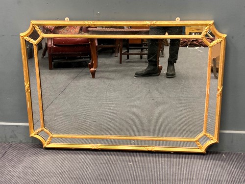 Lot 524 - A rectangular gilt hall mirror the central...