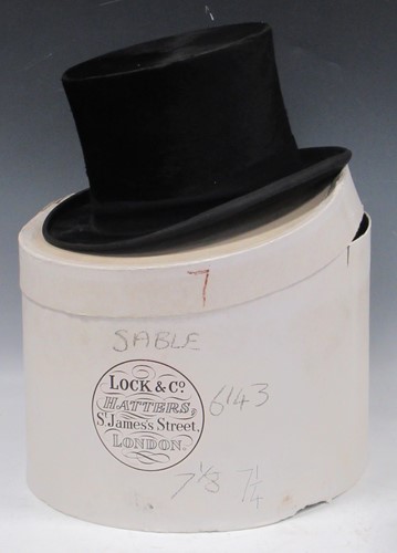 Lot 120 - A Lincoln Bennett & co black silk top hat, 20...