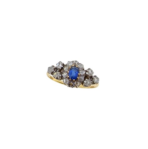 Lot 204 - An early 20th century sapphire and diamond cluster ring