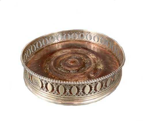 Lot 496 - A George III 18th century silver bottle coaster