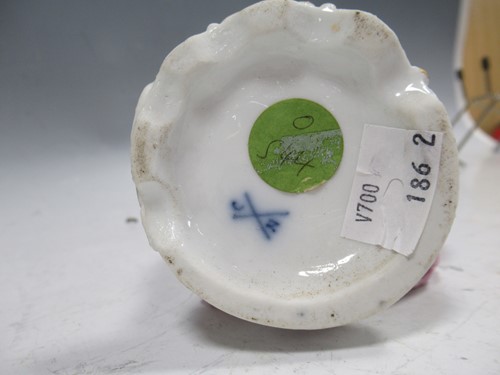 Lot 39 - A German porcelain figure of a lady with a...
