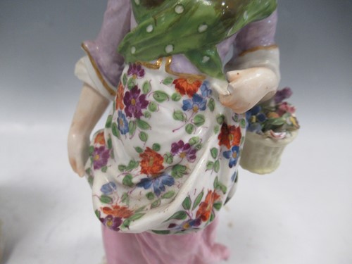 Lot 39 - A German porcelain figure of a lady with a...
