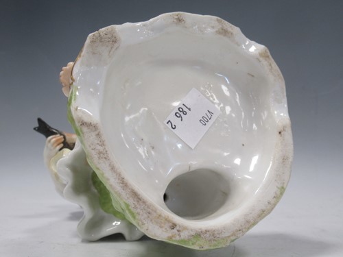 Lot 39 - A German porcelain figure of a lady with a...