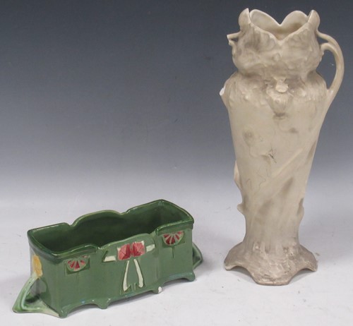 Lot 46 - An Art Nouveau green glazed rectangular...