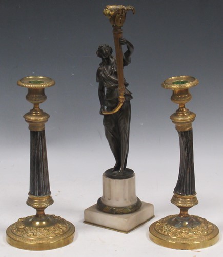 Lot 89 - A gilt and patinated bronze figural...