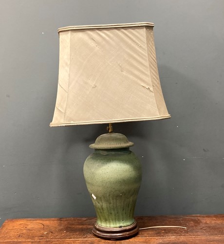 Lot 41 - A green glazed ceramic baluster vase lamp base...