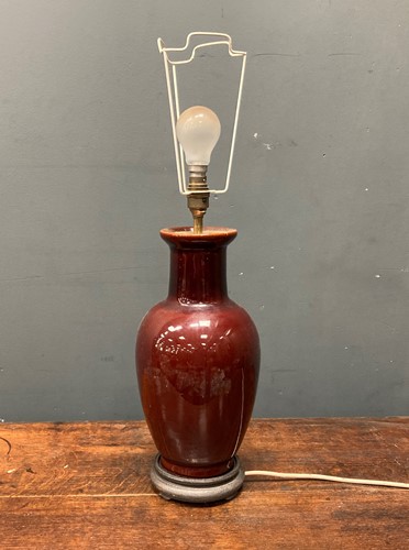 Lot 42 - A sang de boeuf type glazed ceramic lamp base,...