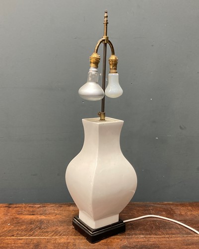 Lot 43 - A white glazed ceramic lamp base in the...