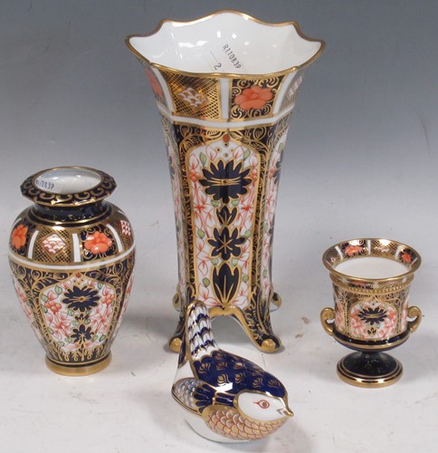 Lot 34 - Royal Crown Derby - a flared rim vase on four...