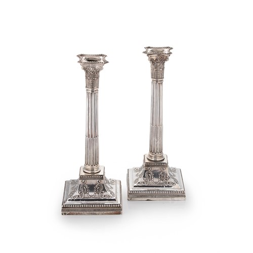 Lot 520 - A pair of late Victorian silver candlesticks