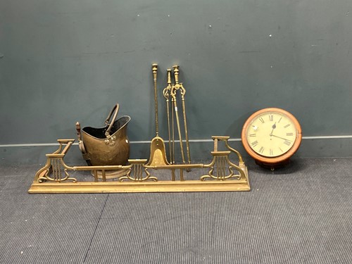 Lot 533 - A brass fender, fire tools and bucket; with a...