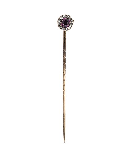 Lot 160 - A pink sapphire and diamond stick pin