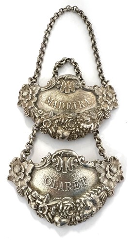 Lot 430 - A pair of George III silver cast wine labels, mark of Paul Storr