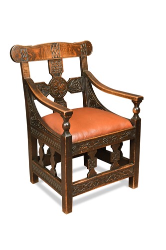 Lot 169 - A Scandinavian carved oak chair, possibly retailed by Liberty, circa 1900