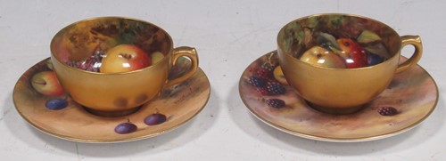 Lot 60 - Two Royal Worcester small tea cups and saucers,...