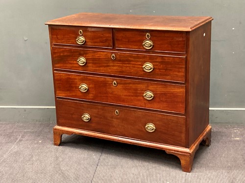Lot 467 - A George III mahogany chest of two short and...