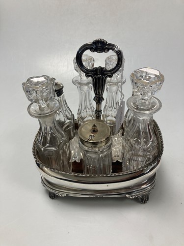 Lot 216 - A Victorian silver seven bottle cruet stand...