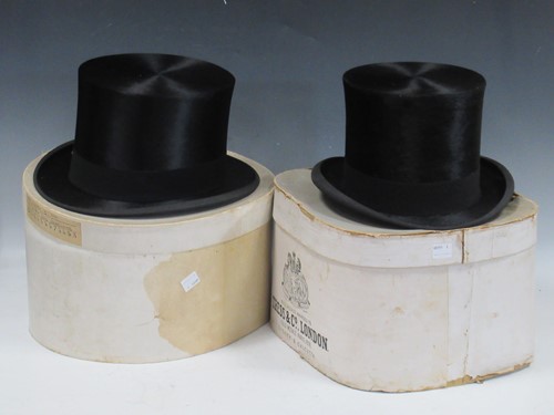 Lot 176 - Two black silk top hats with the original hat...