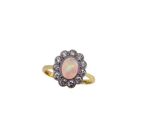 Lot 100 - An opal and diamond cluster ring