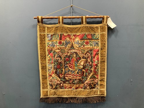Lot 565 - An embroidered wall hanging tapestry with...