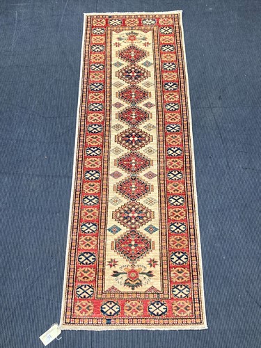 Lot 570 - A Russian Kazak runner 268 x 87cm