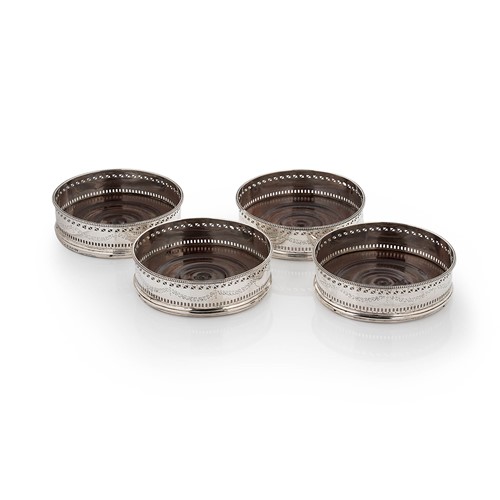 Lot 488 - A set of four George III 18th century silver bottle coasters
