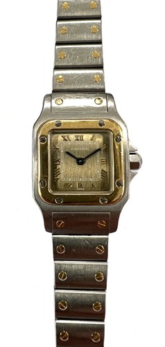 Lot 344 - Cartier - A two-colour 'Santos de Cartier Galbée' wristwatch