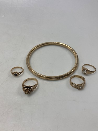 Lot 156 - A hallmarked 9ct gold bangle, together with...