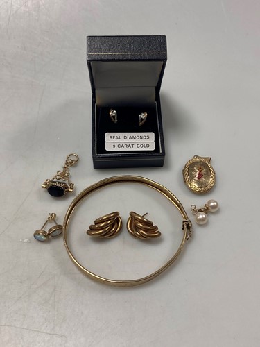 Lot 161 - A bangle tested as 9ct gold, together with a...