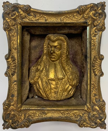 Lot 115 - A gilt metal relief portrait bust of a gentleman, thought to be a judge