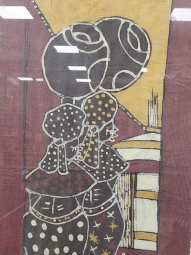 Lot 305 - An framed African Batik of ladies in...