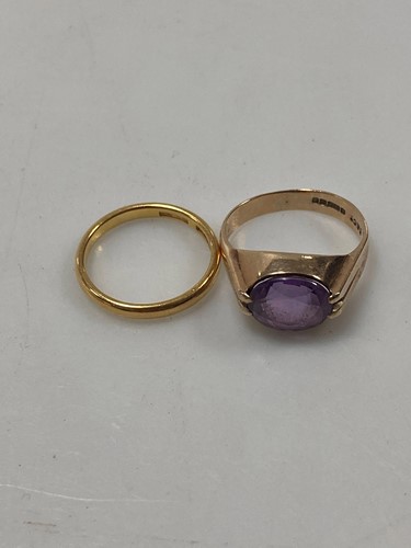 Lot 146 - A hallmarked 22ct gold wedding band, weight...