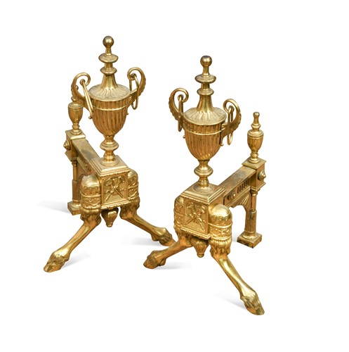 Lot 812 - A pair of brass andirons in the Adam style, 20th century