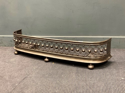 Lot 380 - A George III steel fender on ball feet 25 x...