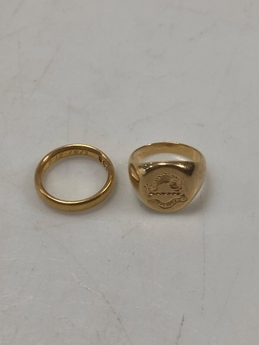 Lot 148 - A wedding band tested as 22ct gold, weight...
