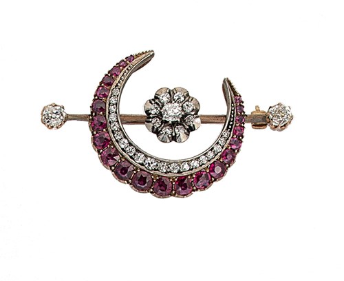 Lot 143 - A ruby and diamond crescent brooch