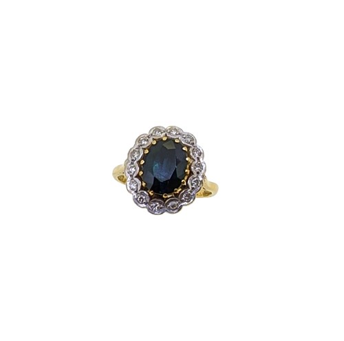 Lot 202 - An 18ct gold sapphire and diamond cluster ring