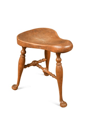 Lot 770 - An elm saddle stool