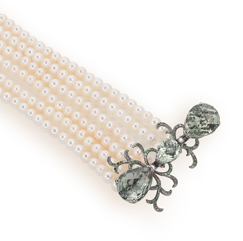 Lot 124 - A pearl necklace with a prasiolite and diamond set fancy clasp