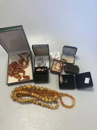 Lot 174 - Three amber necklaces, together with a...
