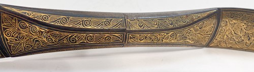 Lot 628 - A North Indian gold damascened steel bow, late 19th/early 20th century