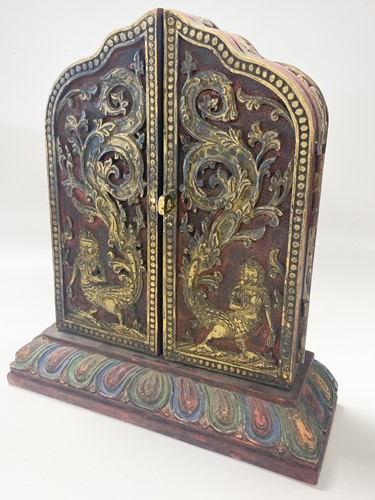 Lot 119 - A Tibetan wood encased tsa tsa shrine, 20th century